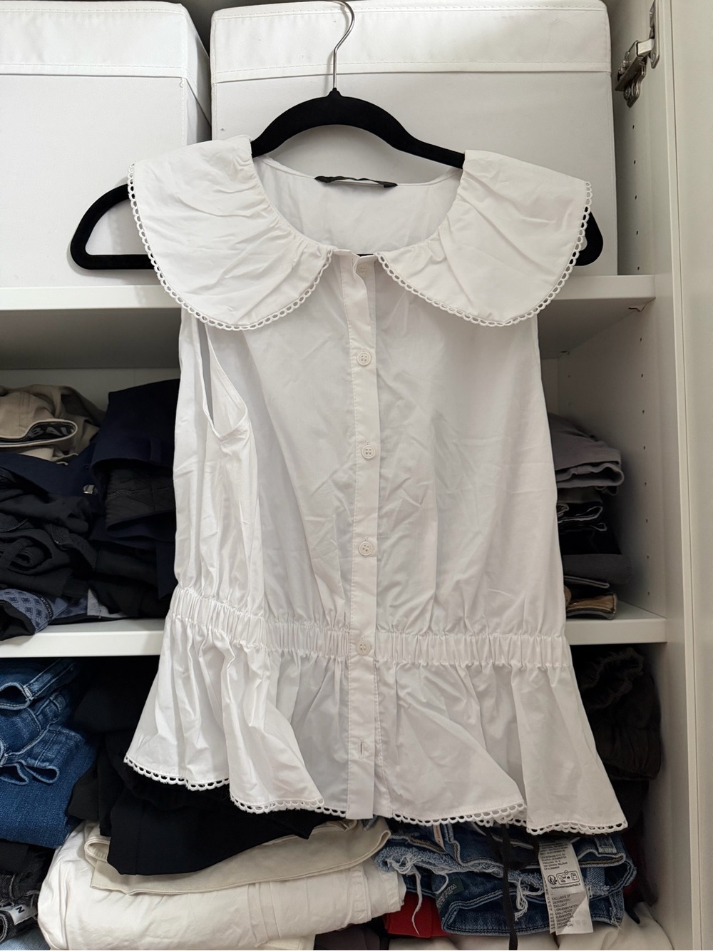 Sleeveless White Peplum Button-Front Top with Peter Pan Collar